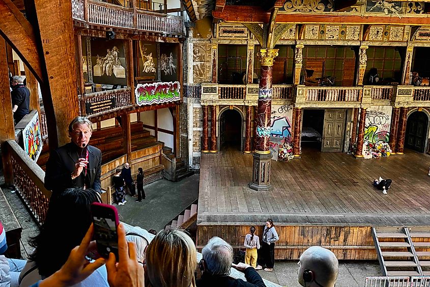 Tour guide overlooking the stage at the Globe. Image credit: Bryan Dearsley