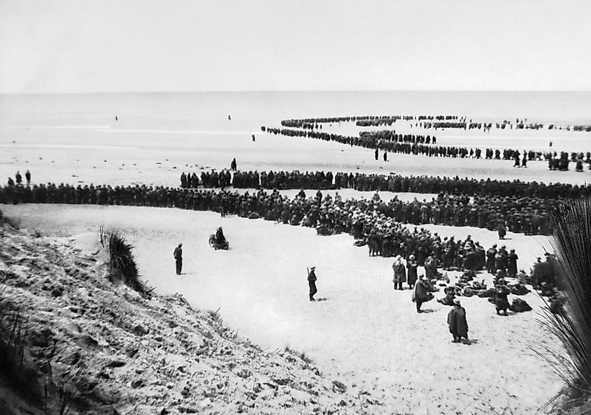 British troops lined up on the beach awaiting evacuation