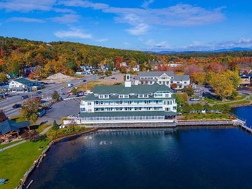 Bay point at Mill Falls with fall foliage aerial view with Meredith Bay in Lake Winnipesaukee in town of Meredith, New Hampshire NH, USA.