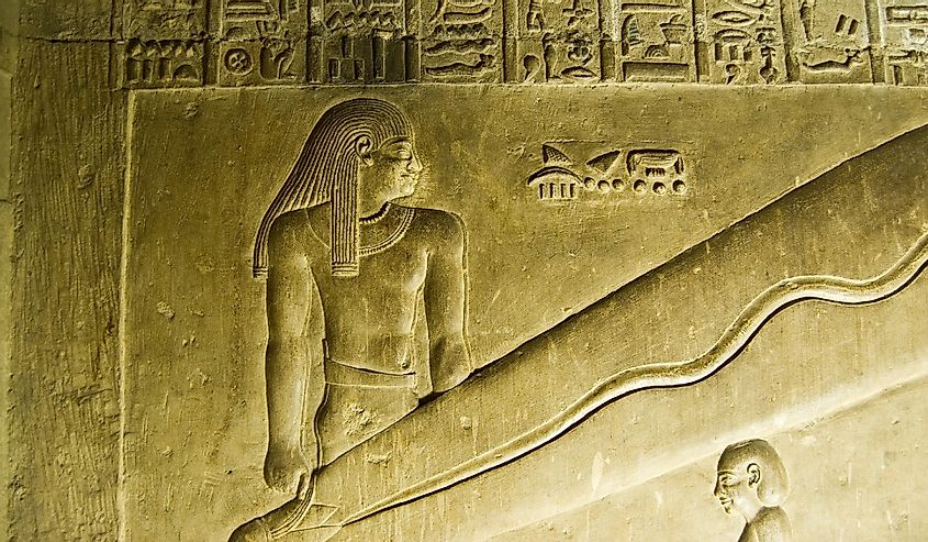 Detail of the famous hieroglyphic carving at the Temple of Hathor at Dendera in Egypt. Known as the Dendera Lights the ancient, underground carving appears to show large lightbulbs.