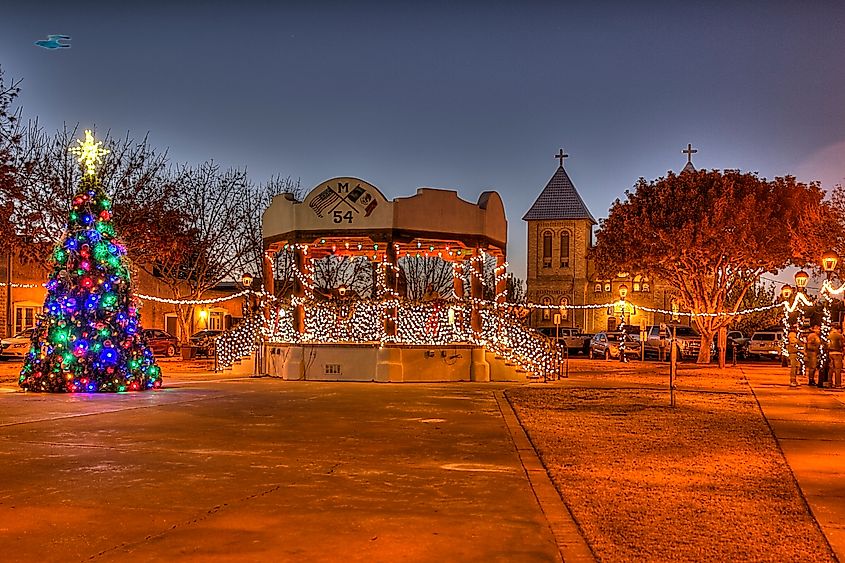 A Christmas tree and decorated bandstand near the Basilica of San Albino in Mesilla, New Mexico.