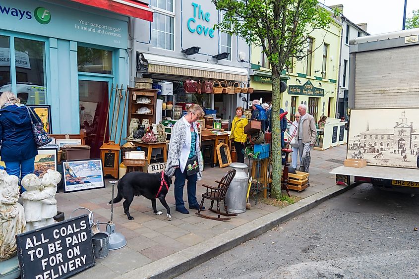 People browsing outside an antique store in Holywood, Northern Ireland