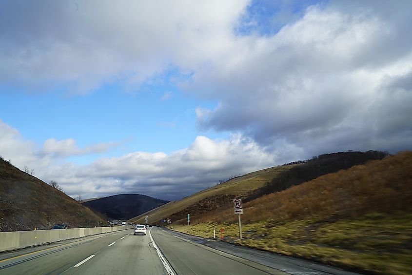 The Pennsylvania Turnpike running through the hilly terrain.