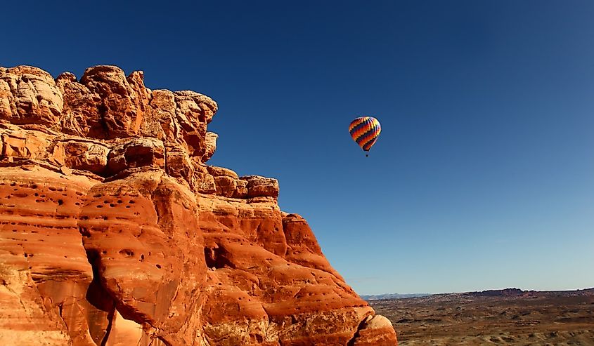 Hot Air Balloon flies over Arches National Park, Utah.