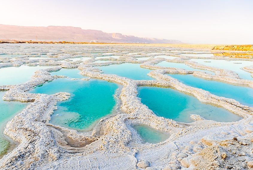 View of Dead Sea coastline. Salt crystals at sunset. Texture of Dead sea. Salty sea shore