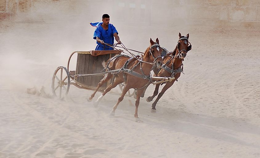 A rider on a chariot similar to those used in Ancient Rome by meunierd via Shutterstock