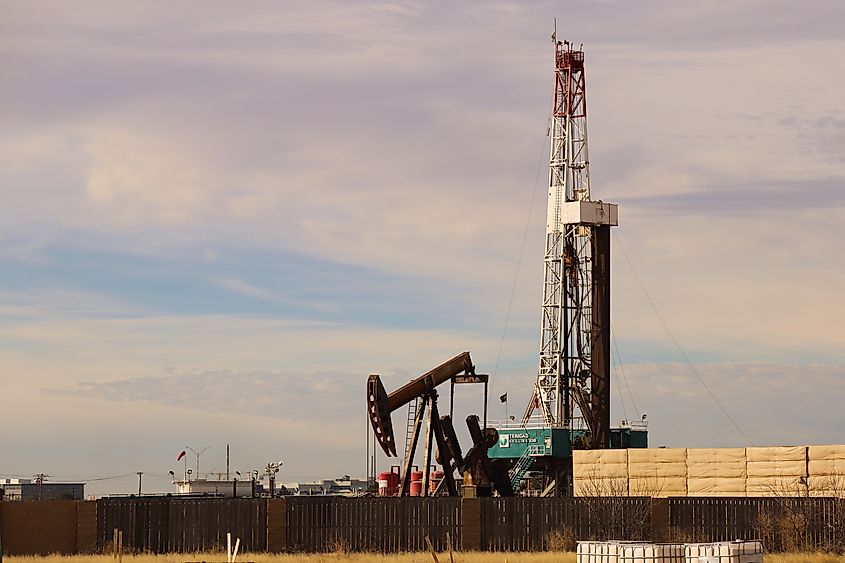 Pumpjack and Drilling Rig in Midland, Texas.
