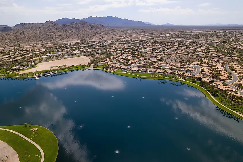 An aerial view of North Lake and Goodyear, Arizona cityscape with mountains in the background.