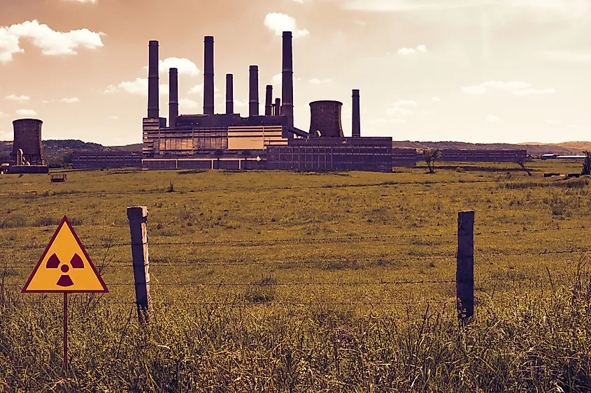 Barbed wire fence and radioactive sign on the nuclear chemical power plant's field in Chernobyl Pripyat atmosphere.