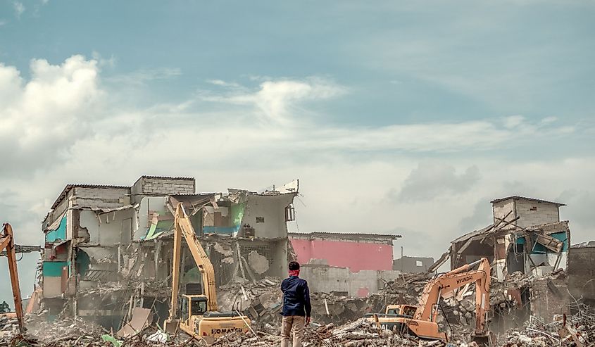 An unidentified man stands among the ruins of demolition at Kalijodo area, Jakarta.