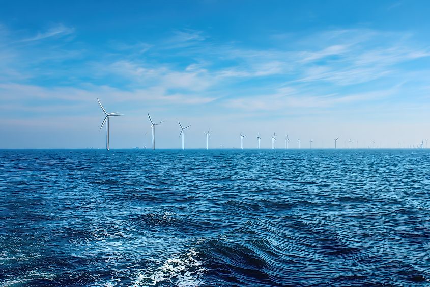 Ocean with wind turbines.