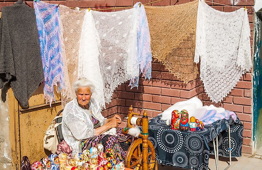 Older mistress knits shawl of goat wool in Sergiev Posad, Russia