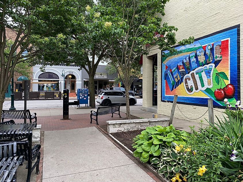 A colorful alleyway mural promoting "Traverse City," just off of main street.