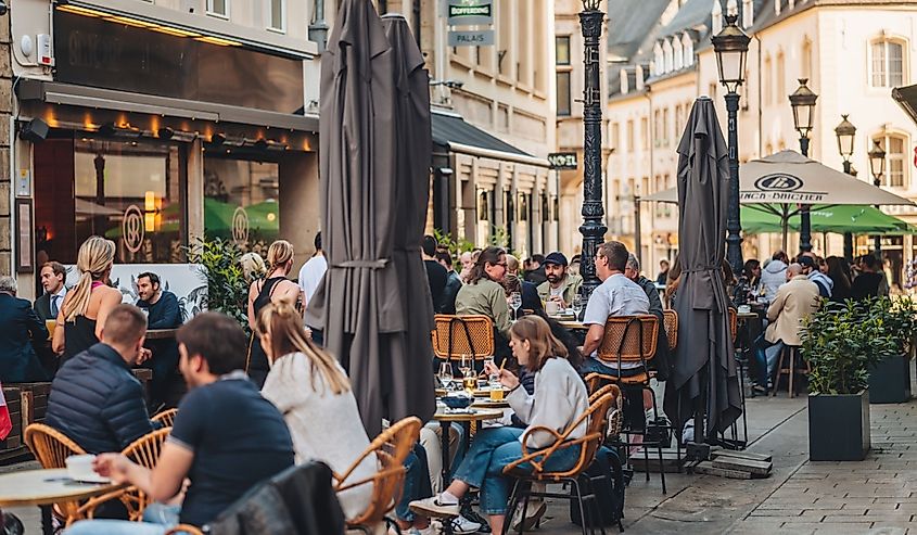 People enjoying bars and terraces on a sunny day in the city