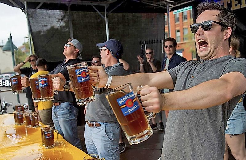 People in Oktoberfest in Denver, Colorado, via