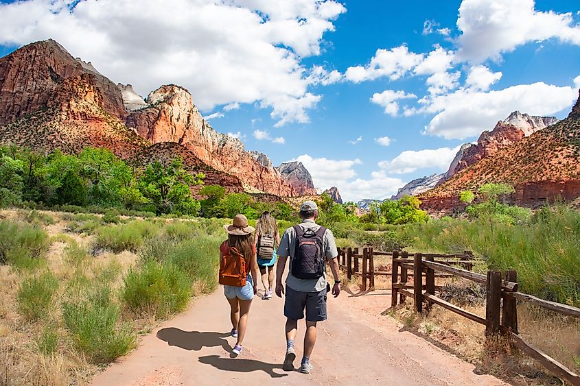 Visitors on a walking trail in the Zion National Park.