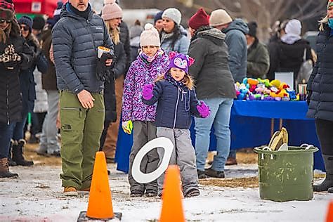 Contestants compete in the Toilet Seat Toss at Winterfest in Fish Creek, Wisconsin.