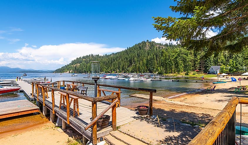 Summer fun at Cavanaugh Bay on Priest Lake as local Idahoans and tourists enjoy the lakefront boat docks and beaches in the mountains of the North Idaho panhandle.