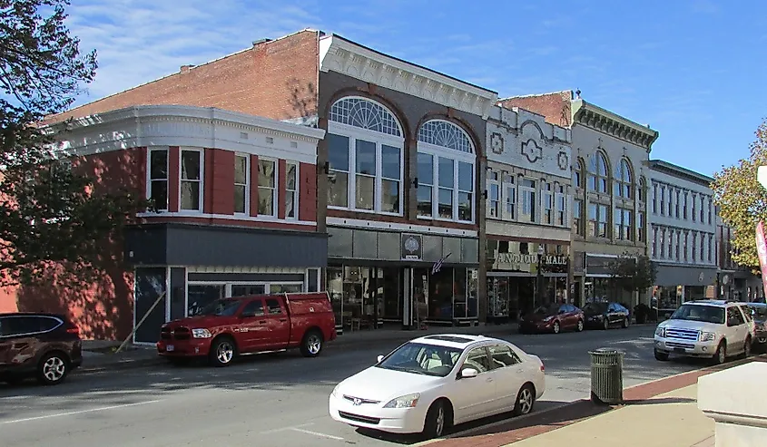 Midland Trail, or Main Street, Shelbyville, Kentucky with buildings and cars. 