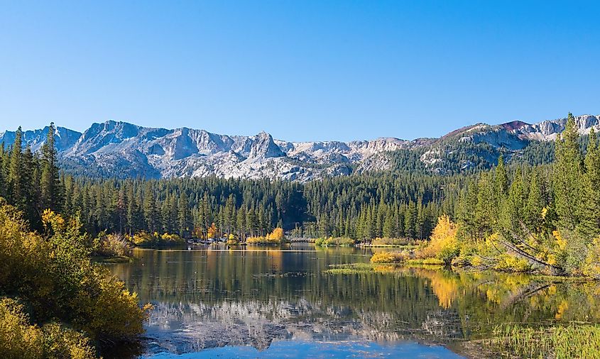 Mammoth Lakes, California, USA, nestled in the Sierra Nevada Mountains, offering stunning natural beauty with clear blue waters, colorful trees, and a serene atmosphere for hiking, fishing, and outdoor exploration.