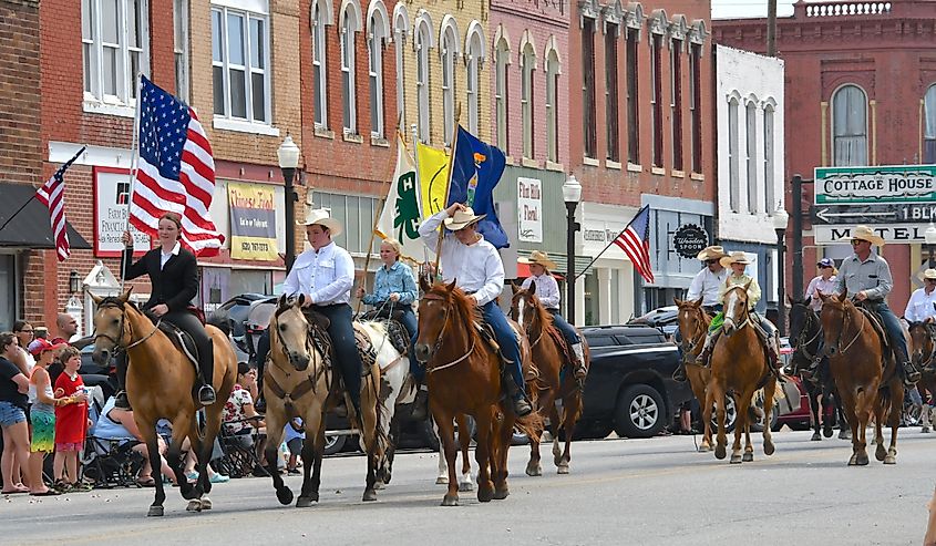 Members of the Local 4 H club ride their horses on Main Street in the Washunga Days Parade