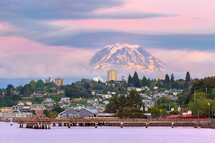 Mount Rainier over Tacoma Washington waterfront during alpenglow sunset evening