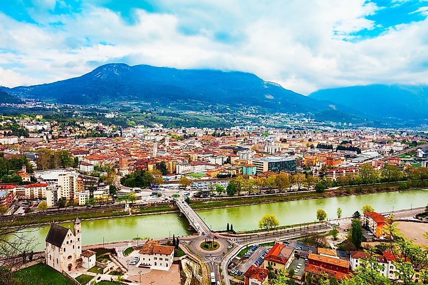 The Adige River flowing through Trento, Italy