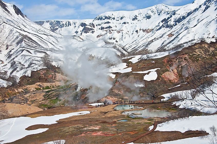Tourists during a tour at the thermal field in the Valley of Geysers in Kronotsky reserve, Kamchatka, Russia.