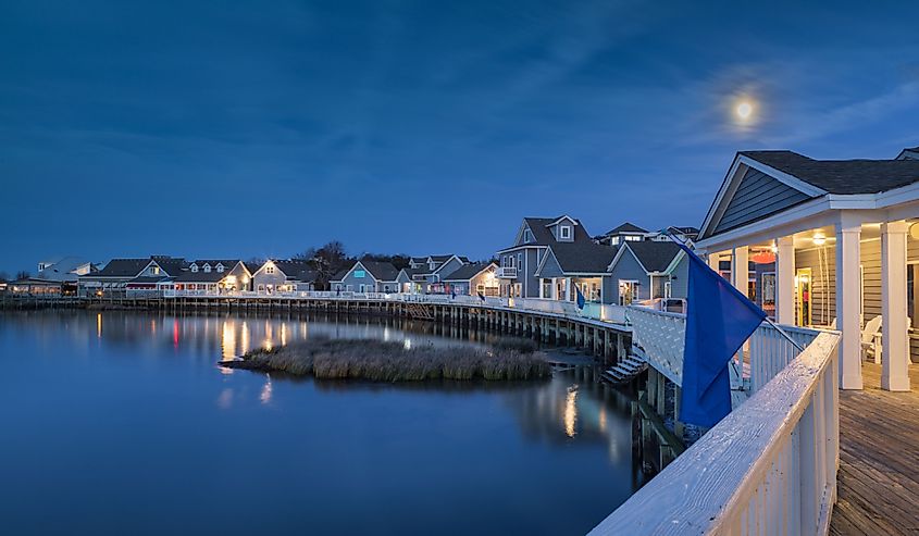 Iconic soundside boardwalk on Currituck Sound under the moonlight in Duck, NC on the Outer Banks.