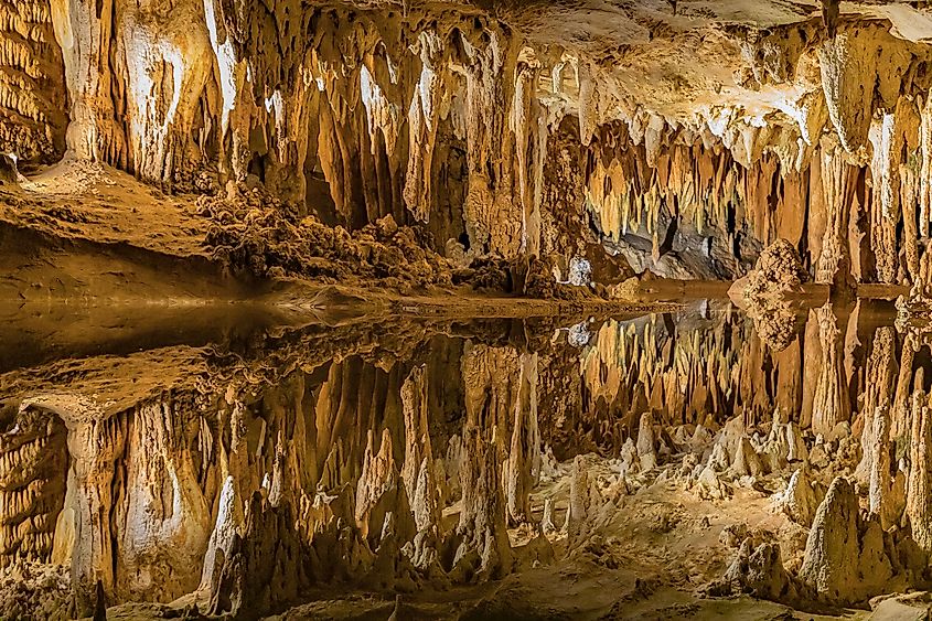Picture inside the Luray Caverns where a pool of water reflects the ceiling above.