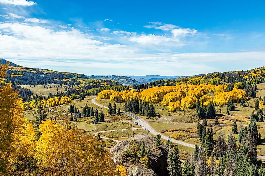 Beautiful mountain scenery with streams, valleys, and color changing trees along a train route from Chama, New Mexico to Antonito, Colorado