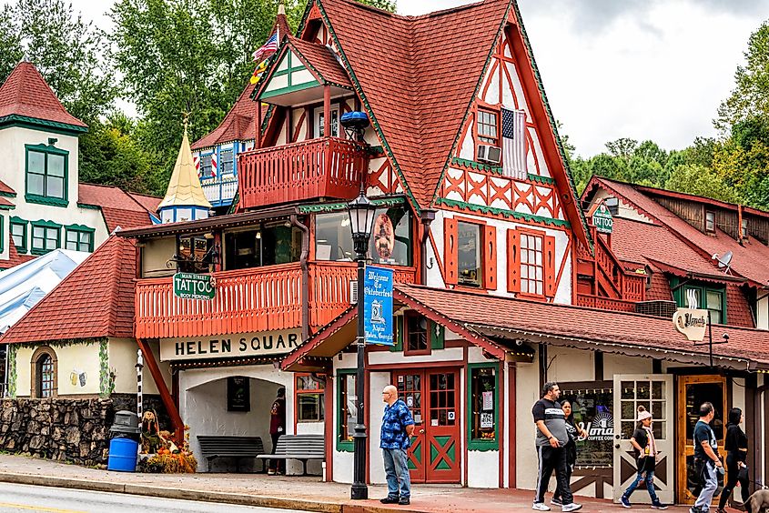 Traditional Bavarian-style house building with a sign for Helen Square on Main Street in Helen, Georgia, USA.