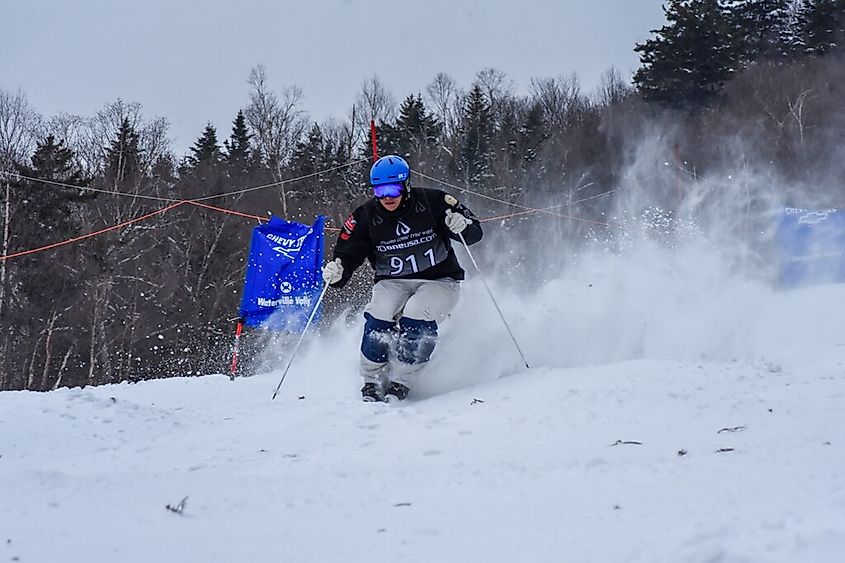 An athlete navigating moguls on the "True Grit" trail at Waterville Valley Resort.