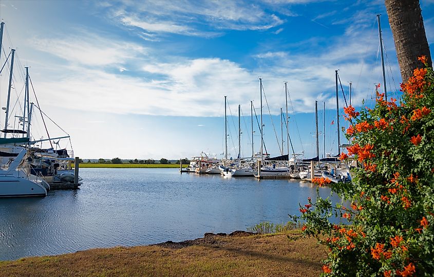 A beautiful view of the Brunswick Marina with clouds hovering over the ships