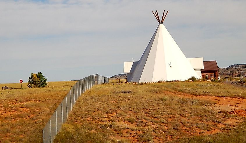 Giant white Native American teepee house at the Vore Buffalo Jump archaeological site of northeast Wyoming in Sundance