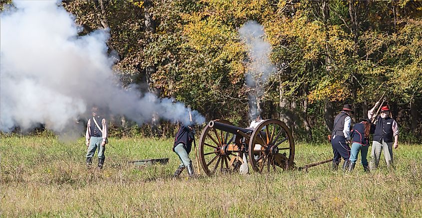A cannon fires during a Civil War battle reenactment at Historic Brattonsville, a living history museum.