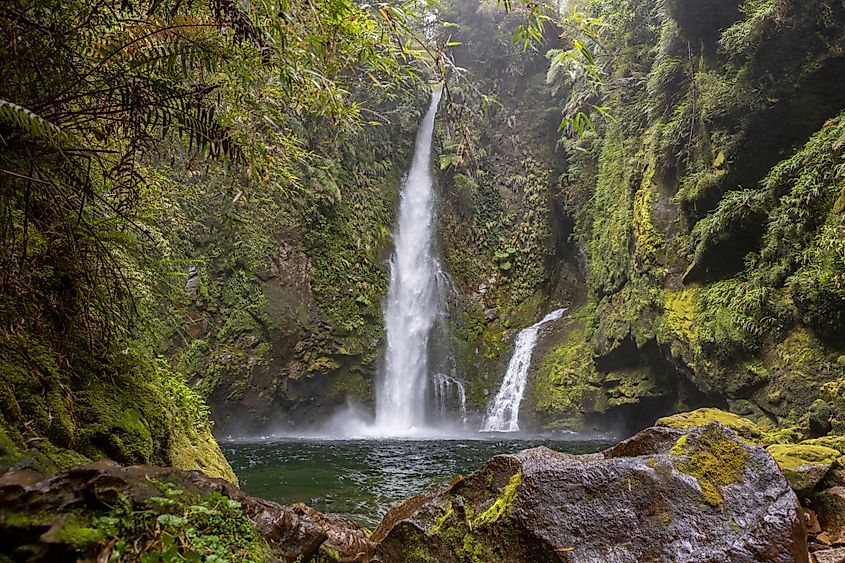Waterfall view while hiking the Sendero Cascadas Escondidas in the Parque Nacional Pumalín Douglas Tompkins in Patagonia, Chile (Freedom_wanted / Shutterstock)