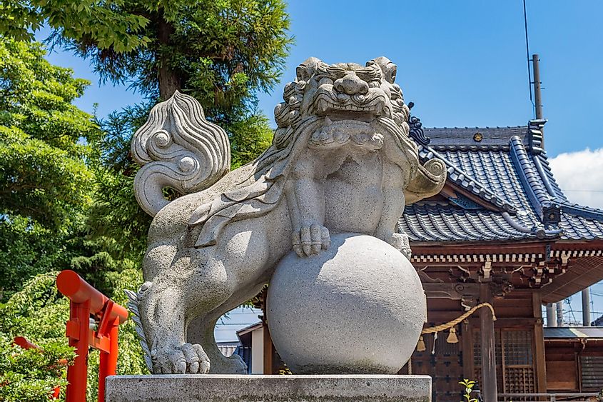 Lion-dog, or komainu, at Miumajinja shinto shrine, Kanazawa, Japan. These traditional statues are seen in pairs in most shrines and are intended to ward off evil spirits.