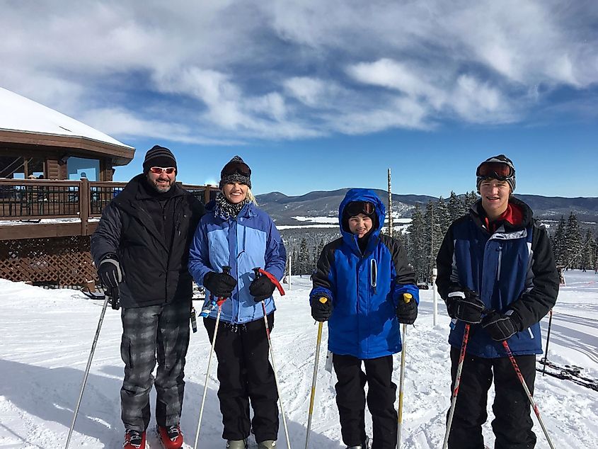 Portrait of a family of four on a ski vacation at a ski resort in Angel Fire, New Mexico. 