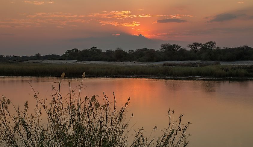 Sunset above Angola, Cubango river, Caprivi Strip, Namibia, Africa