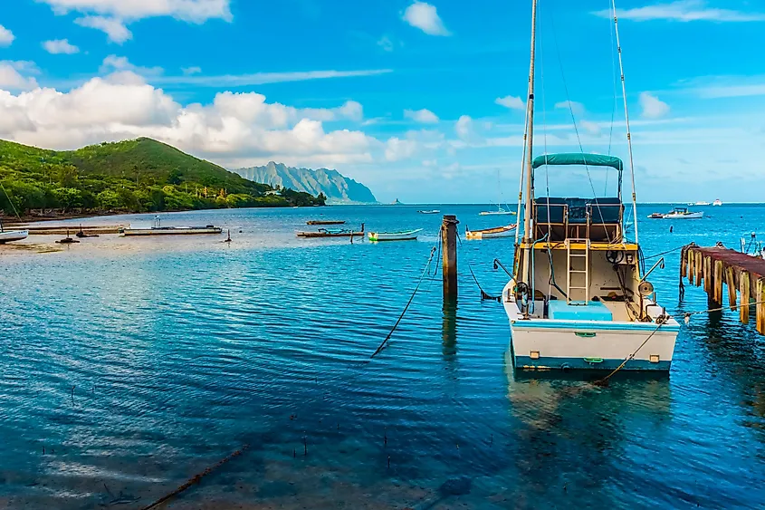 Charter Fishing Boat Moored at He'eia Kea Marina With Mokolii Island (Chinamans Hat) Across Kaneohe Bay, Oahu, Hawaii, USA