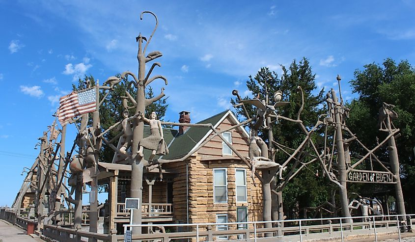 A shot of the Garden of Eden in Lucas Kansas with blue sky and white clouds