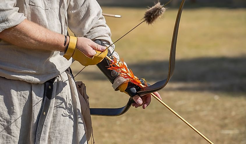 Medieval recurve bow in an archer's hand
