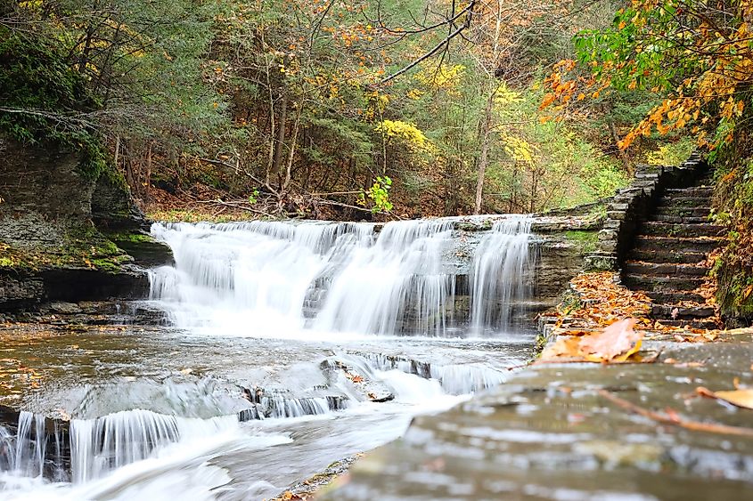 Autumn scene landscape of waterfalls at Robert H. Treman State Park. Credit: Haveseen/ Shutterstock.com