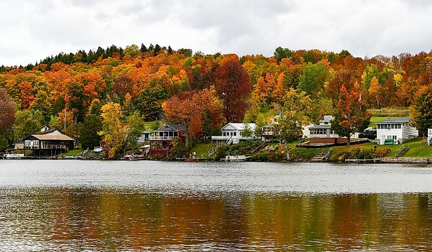 Homes along Lake Elmore, Vermont with fall foliage