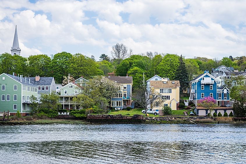 Mill River in New Haven, Connecticut, with calm water reflecting surrounding trees
