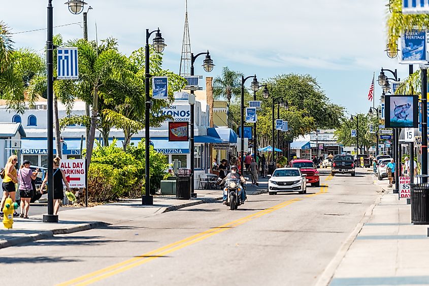 Colorful buildings with blue banners on Dodecanese Boulevard in Tarpon Springs, Florida.