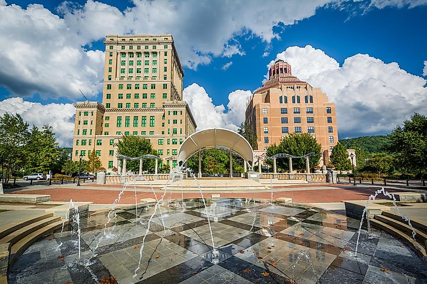 Fountains at Park Square Park and buildings in downtown Asheville, North Carolina.