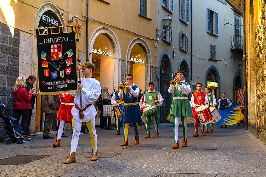 A band marching through the historical streets of Orvieto, Italy