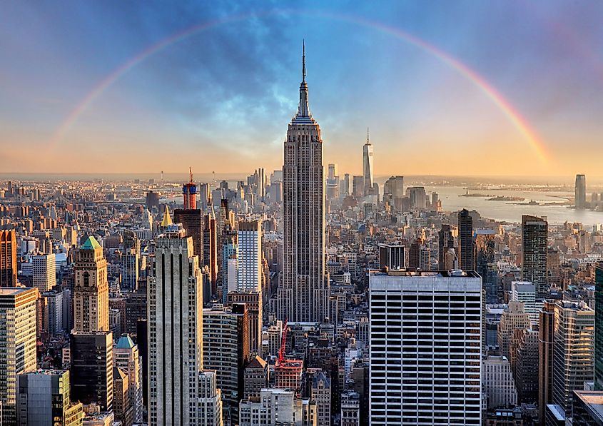 Manhattan downtown skyline with the Empire State Building, other skyscrapers and a rainbow.